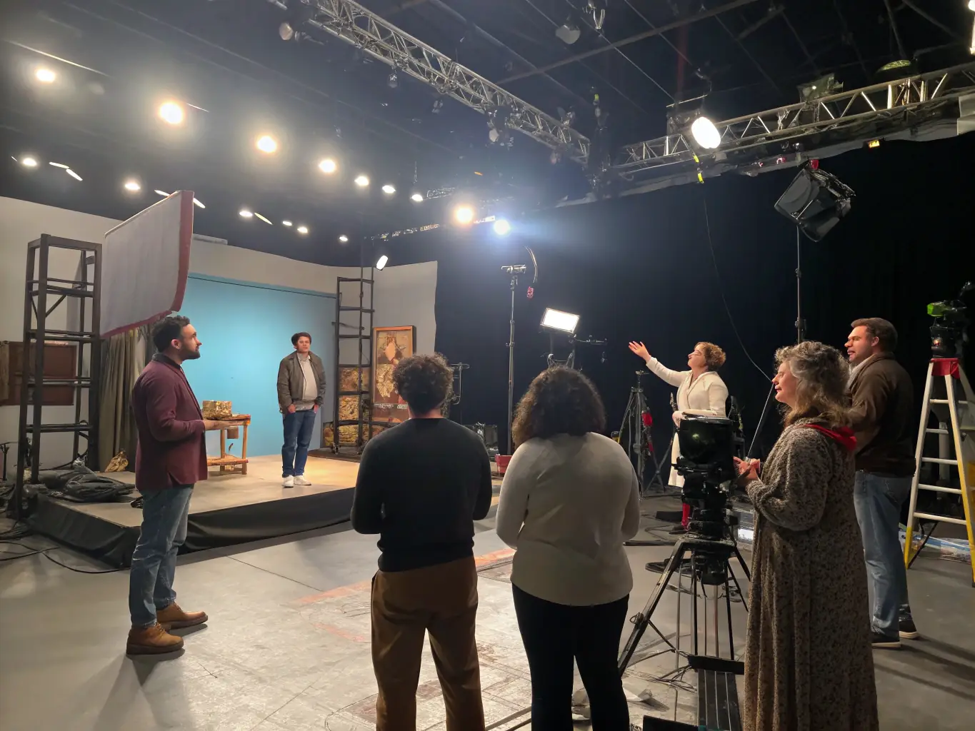 A photograph capturing a dynamic theater workshop in progress, showcasing participants actively engaged in acting exercises and scene development, reflecting the association's commitment to performing arts.